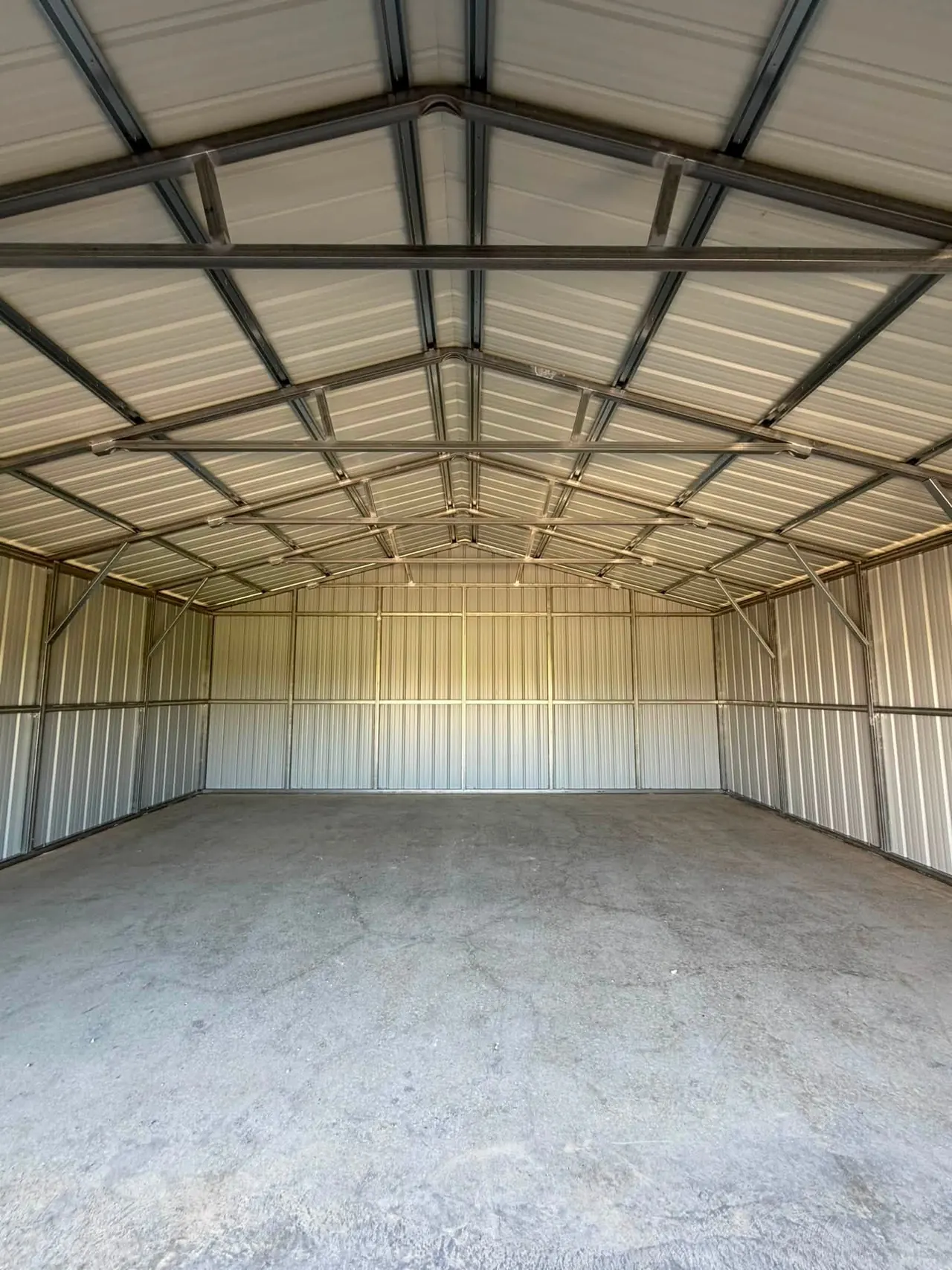 Inside a metal building showing the steel frame